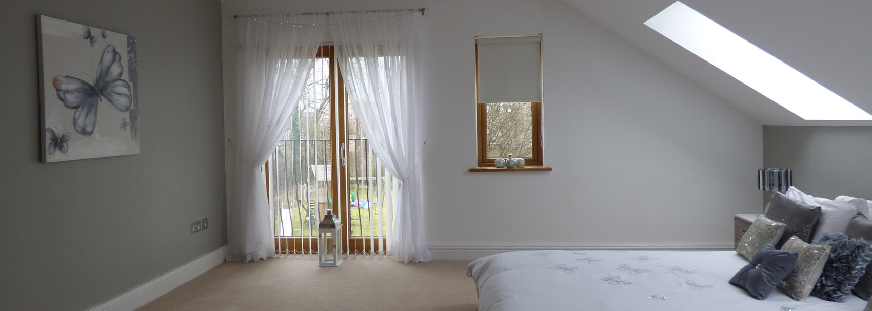 A finished loft conversion bedroom by Herts Loft Conversions